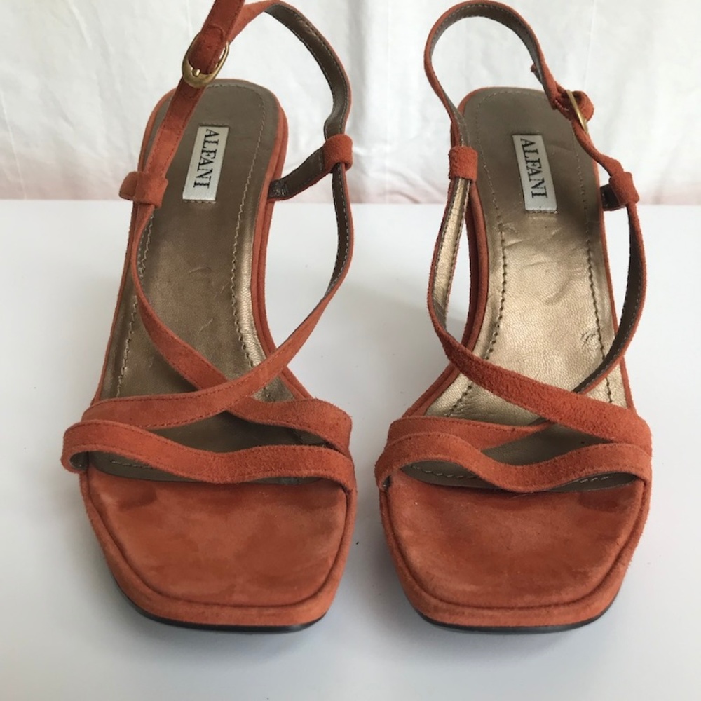 Orange suede wedge sandals with embellished heel